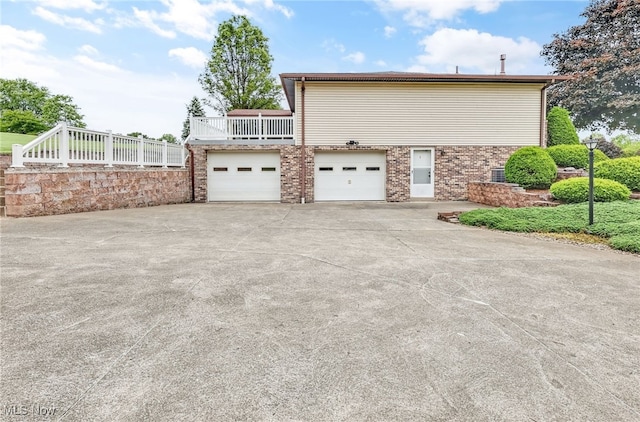 14031405 Frank Dr, Wooster, OH 44691 - view of side of home with driveway, a garage, and brick siding