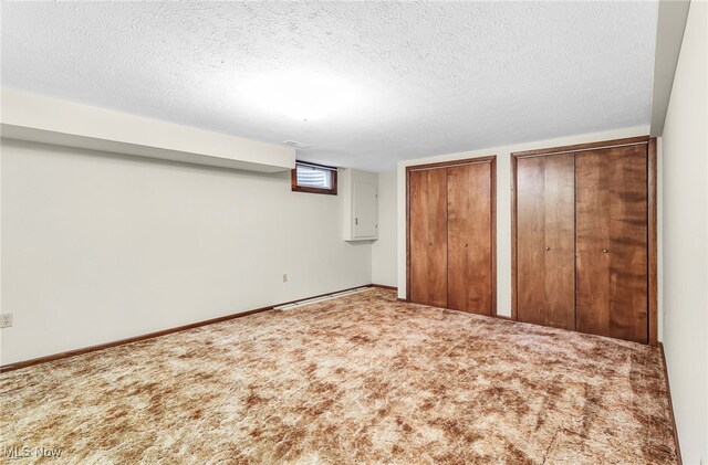 14031405 Frank Dr, Wooster, OH 44691 - unfurnished bedroom with two closets, carpet floors, and a textured ceiling