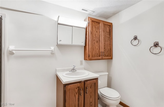 14031405 Frank Dr, Wooster, OH 44691 - bathroom with vanity, toilet, and a textured ceiling