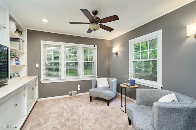 4531 Ardendale Rd, South Euclid, OH 44121 - living area featuring a ceiling fan, light colored carpet, baseboards, and crown molding