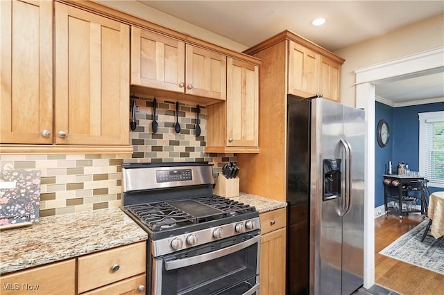4531 Ardendale Rd, South Euclid, OH 44121 - kitchen with stainless steel appliances, light brown cabinets, ornamental molding, backsplash, and light stone counters