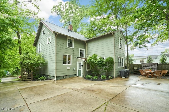 4531 Ardendale Rd, South Euclid, OH 44121 - rear view of property with a patio area and a chimney