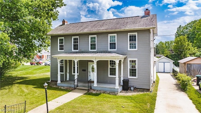 view of front facade featuring covered porch, a chimney, and a detached garage