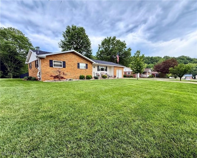 52 Woodlawn Ave, Belpre, OH 45714 - ranch-style home with brick siding and a front yard