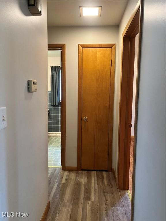 213 Kenmore Ave SE, Warren, OH 44483 - hallway featuring wood finished floors and baseboards