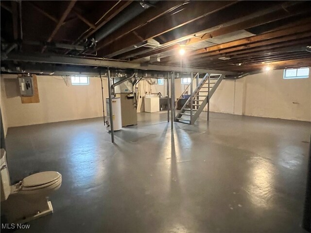 213 Kenmore Ave SE, Warren, OH 44483 - basement with stairway, washing machine and dryer, water heater, and electric panel