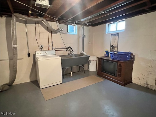 213 Kenmore Ave SE, Warren, OH 44483 - below grade area with washer / dryer, a sink, and healthy amount of natural light
