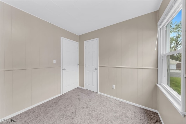 180 Glenn St, Barberton, OH 44203 - spare room featuring carpet and baseboards