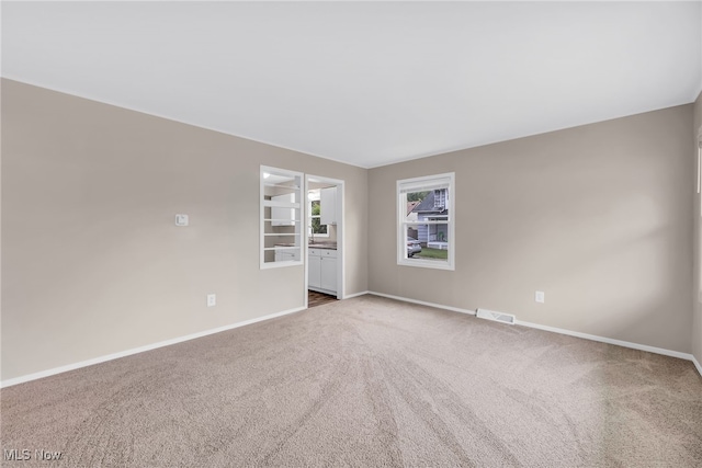 180 Glenn St, Barberton, OH 44203 - unfurnished room with baseboards and carpet