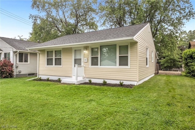 180 Glenn St, Barberton, OH 44203 - view of front of house featuring a front lawn and a shingled roof