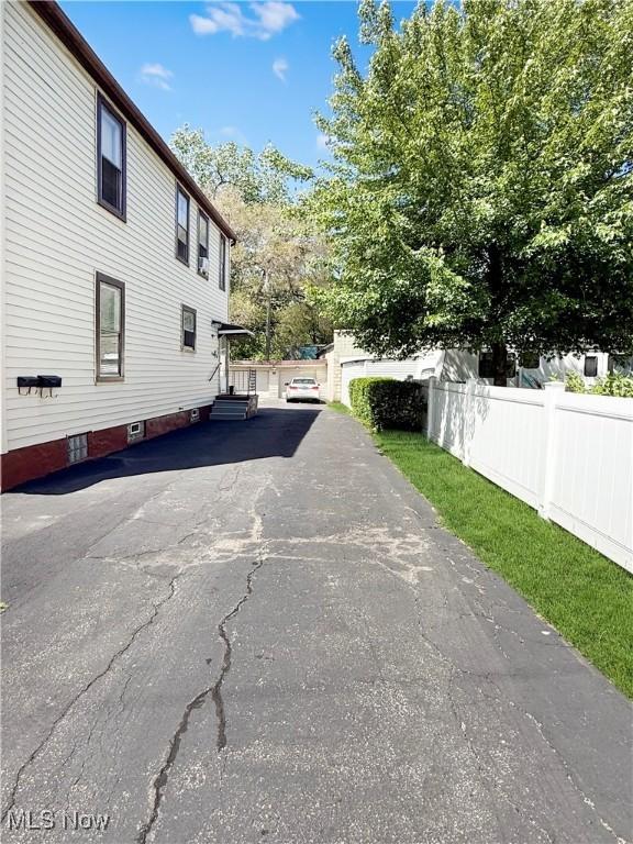 5417 Brow Ave, Newburgh Heights, OH 44105 - view of home's exterior with entry steps and asphalt driveway
