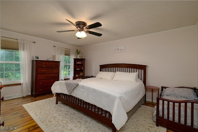 20686 Wildwood Ln, Strongsville, OH 44149 - bedroom featuring wood finished floors, ornamental molding, a ceiling fan, and baseboards