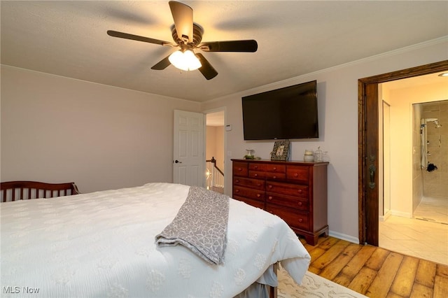 20686 Wildwood Ln, Strongsville, OH 44149 - bedroom with light wood finished floors, a ceiling fan, baseboards, and ensuite bath