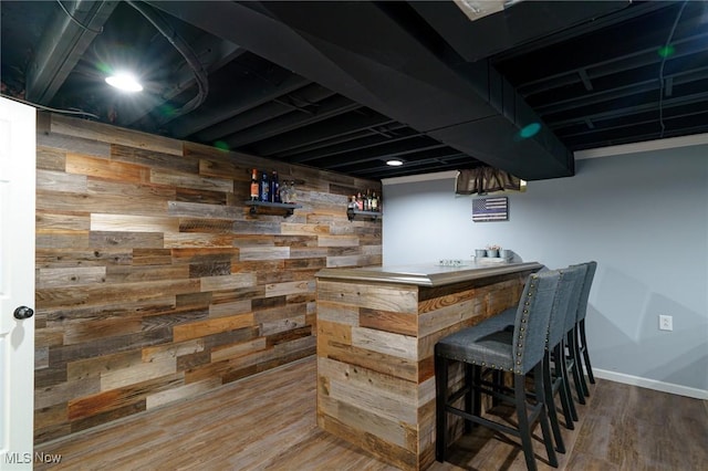 20686 Wildwood Ln, Strongsville, OH 44149 - indoor dry bar featuring wood finished floors, baseboards, and wooden walls