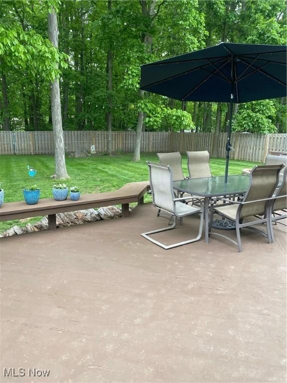 20686 Wildwood Ln, Strongsville, OH 44149 - view of patio featuring outdoor dining space and view of wooded area