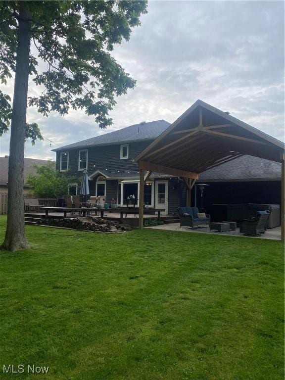 20686 Wildwood Ln, Strongsville, OH 44149 - back of house featuring outdoor lounge area, a yard, and a patio
