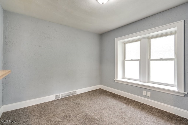 1866 17th St SW, Akron, OH 44314 - unfurnished room featuring carpet flooring and baseboards