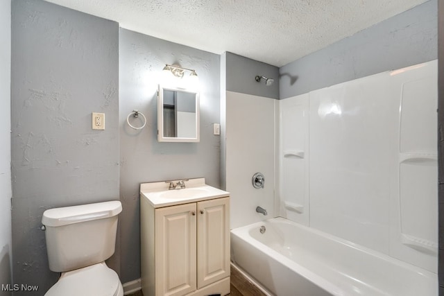 1866 17th St SW, Akron, OH 44314 - bathroom featuring a textured ceiling, toilet, vanity, and  shower combination