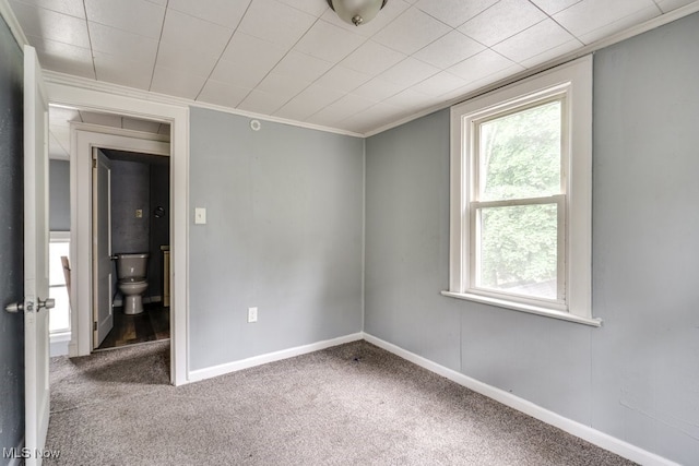 1866 17th St SW, Akron, OH 44314 - spare room featuring crown molding, carpet floors, and baseboards