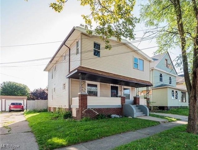 2179 W 106th St, Cleveland, OH 44102 - view of front of property with a front yard and covered porch