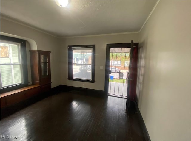 2179 W 106th St, Cleveland, OH 44102 - spare room featuring dark wood-style floors and crown molding