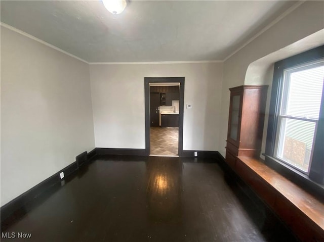 2179 W 106th St, Cleveland, OH 44102 - spare room featuring baseboards, crown molding, and wood finished floors