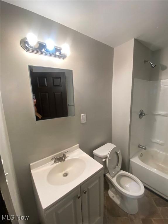 2179 W 106th St, Cleveland, OH 44102 - bathroom featuring vanity, toilet, and washtub / shower combination