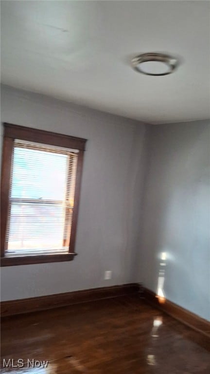 3301 W 94th St, Cleveland, OH 44102 - unfurnished room featuring baseboards and dark wood finished floors