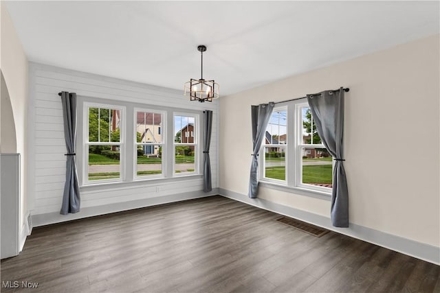 3652 Brightway St, Weirton, WV 26062 - unfurnished dining area with a chandelier, wood finished floors, and baseboards