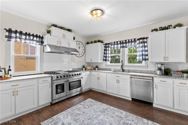 3652 Brightway St, Weirton, WV 26062 - kitchen with stainless steel appliances, a sink, under cabinet range hood, backsplash, and white cabinets