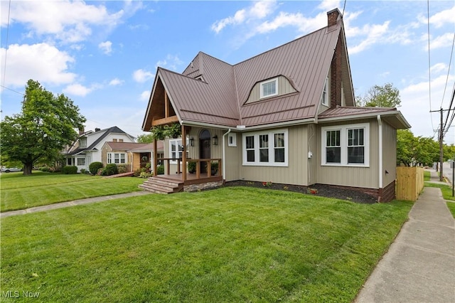 3652 Brightway St, Weirton, WV 26062 - view of front facade with a front yard, a chimney, metal roof, and a standing seam roof