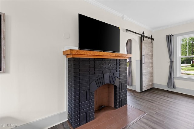 3652 Brightway St, Weirton, WV 26062 - detailed view of a barn door, wood finished floors, crown molding, baseboards, and a brick fireplace
