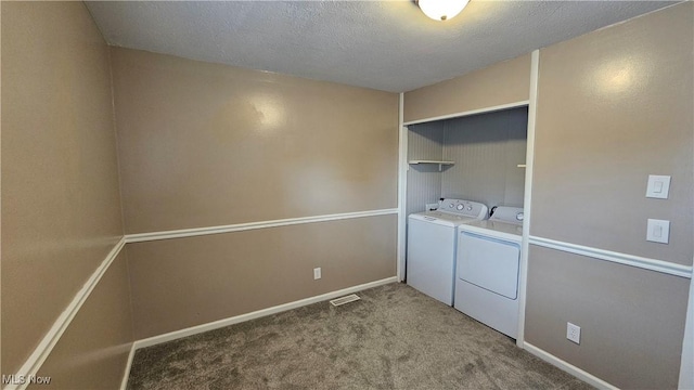 3970 Royal Liverpool Dr Unit A, Uniontown, OH 44685 - washroom featuring separate washer and dryer, carpet floors, a textured ceiling, and baseboards
