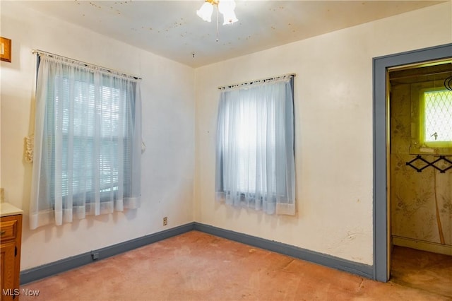 2200 7th Ave, Parkersburg, WV 26101 - unfurnished room featuring light colored carpet, baseboards, and ceiling fan