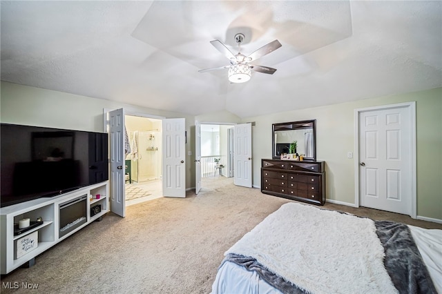 20393 Wildwood Ln, Strongsville, OH 44149 - carpeted bedroom with vaulted ceiling, baseboards, ensuite bath, and ceiling fan