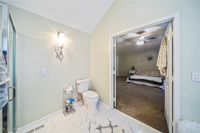 20393 Wildwood Ln, Strongsville, OH 44149 - bathroom with lofted ceiling, toilet, ceiling fan, baseboards, and marble look tiles