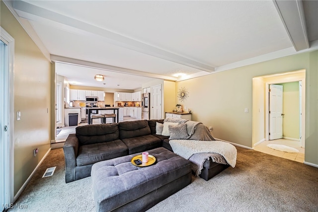 20393 Wildwood Ln, Strongsville, OH 44149 - living room featuring light carpet, beamed ceiling, and baseboards
