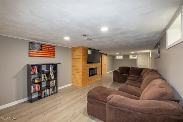 6351 W 130th St, Parma Heights, OH 44130 - living room featuring light wood finished floors, baseboards, a large fireplace, and recessed lighting