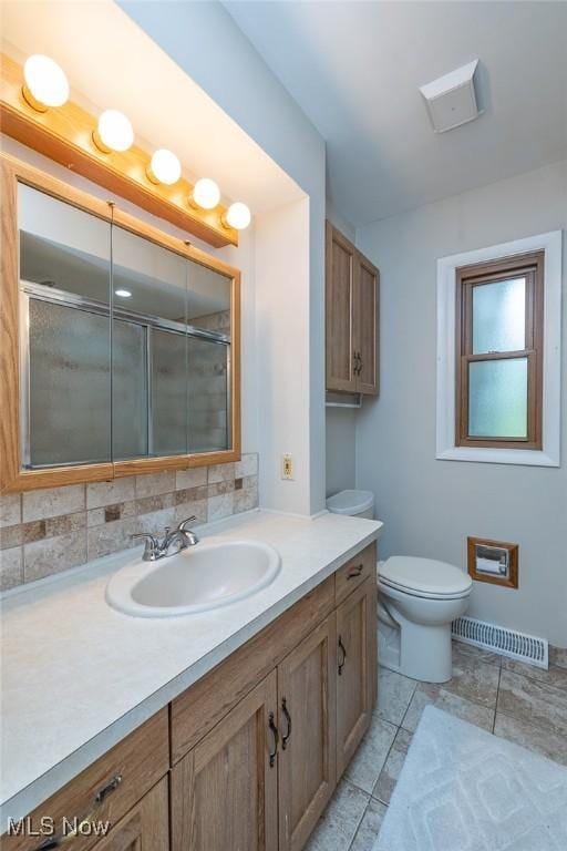 6351 W 130th St, Parma Heights, OH 44130 - full bath featuring vanity, toilet, a shower with shower door, and tile patterned floors