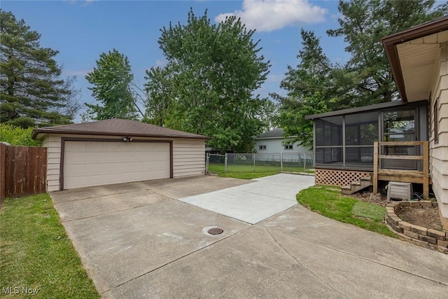 6351 W 130th St, Parma Heights, OH 44130 - view of patio with a sunroom, a garage, and an outdoor structure