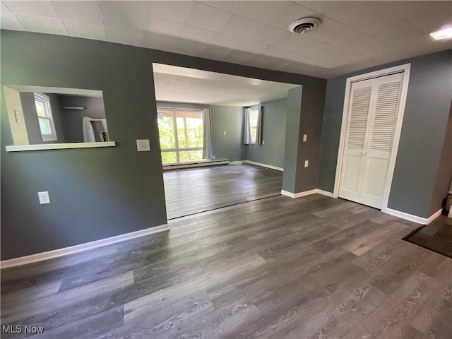 7121 Fable SW, Sherrodsville, OH 44675 - spare room featuring wood finished floors, a baseboard radiator, and baseboards