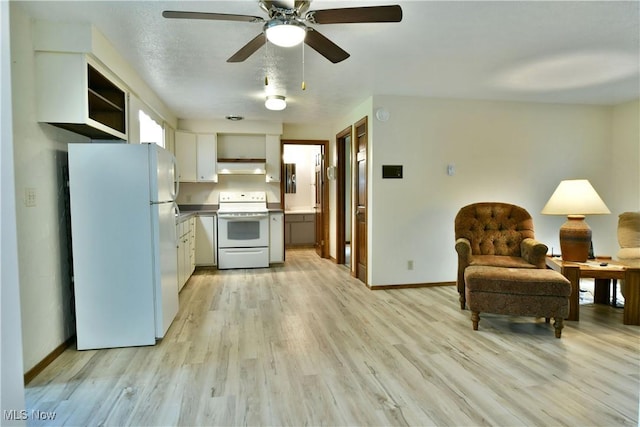 2942 Barclay Messerly Rd, Southington, OH 44470 - kitchen featuring white appliances, exhaust hood, light wood-style flooring, ceiling fan, and white cabinetry