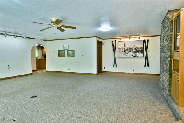 2942 Barclay Messerly Rd, Southington, OH 44470 - unfurnished living room with a ceiling fan, arched walkways, carpet flooring, a textured ceiling, and baseboards