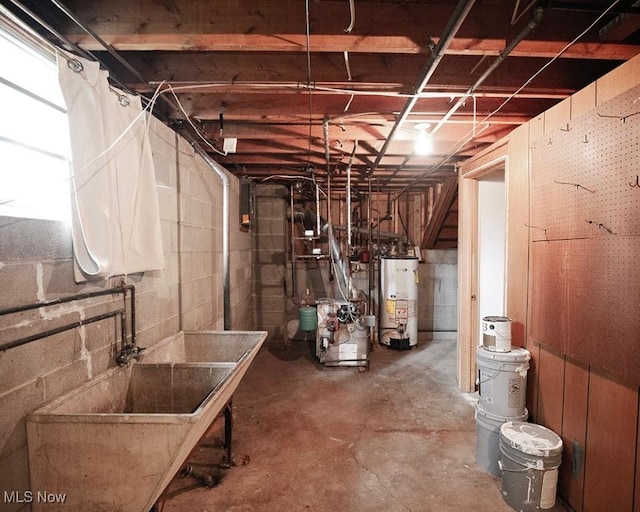 433 University Ave, Elyria, OH 44035 - unfinished basement featuring gas water heater, a sink, a heating unit, and concrete block wall
