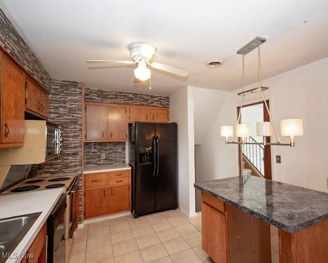 433 University Ave, Elyria, OH 44035 - kitchen with black fridge with ice dispenser, brown cabinets, ceiling fan, and backsplash