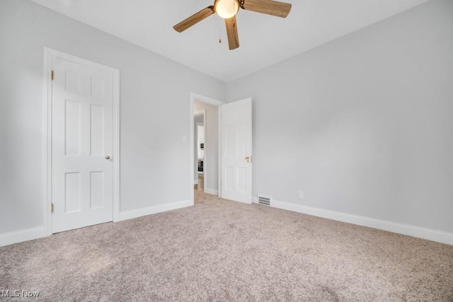 2186 Jackson Blvd, University Heights, OH 44118 - unfurnished bedroom with carpet flooring, baseboards, and ceiling fan