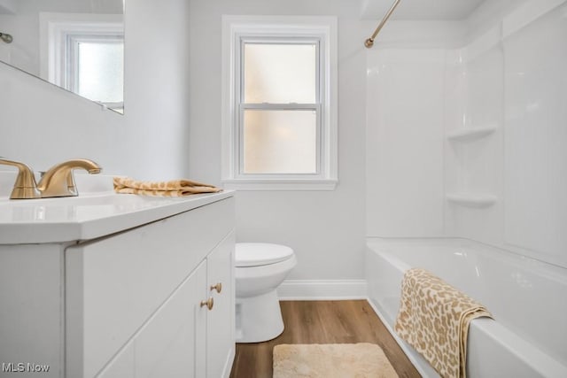 2186 Jackson Blvd, University Heights, OH 44118 - bathroom featuring baseboards, vanity, wood finished floors, toilet, and  shower combination