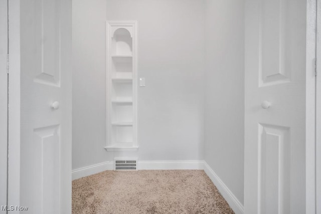 2186 Jackson Blvd, University Heights, OH 44118 - spare room featuring baseboards, built in features, and carpet flooring