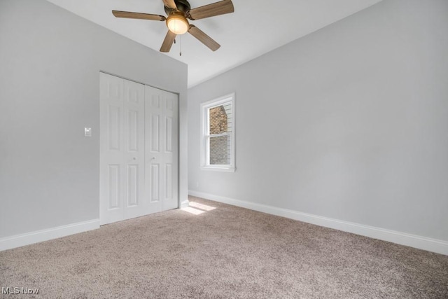 2186 Jackson Blvd, University Heights, OH 44118 - unfurnished bedroom with carpet flooring, a closet, baseboards, and a ceiling fan