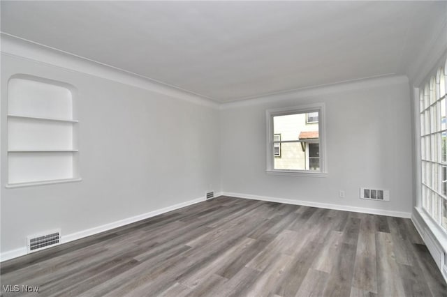 3890 Grosvenor Rd, South Euclid, OH 44118 - empty room featuring dark wood-style flooring and baseboards